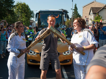 Reda Vida Gani passed the torch to Margaret Loveridge before it continued its journey into Kingston town centre.