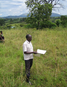Local headmaster Robert Kamasaka stands on the site of the new centre.