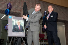 Willie Walsh examines the plaque commemorating the opening of the new Kingston Business School.